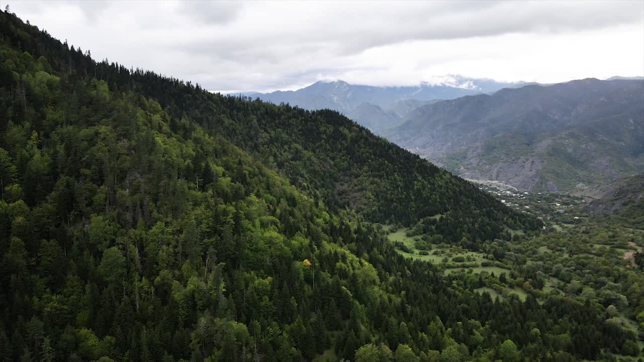 drone shot of beautiful green mountains cloud sky