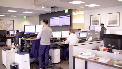 A busy office space with employees working at their desks
