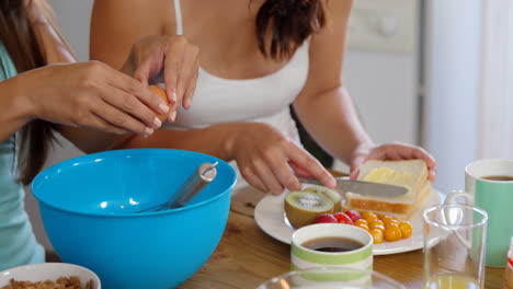 Smiling-friends-having-breakfast-