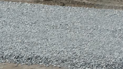 excavator carries gravel in the bucket