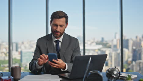 smiling accountant looking computer browsing online. company worker using cell
