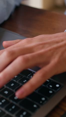 person typing on a laptop