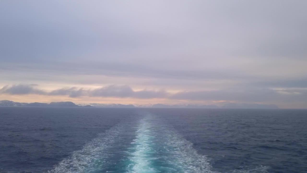 The view of clouds and mist from the deck of a cruise ship sailing along the coast of Norway