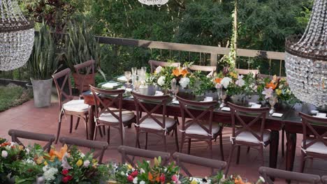 a large table with many chairs and a crystal chandelier above it