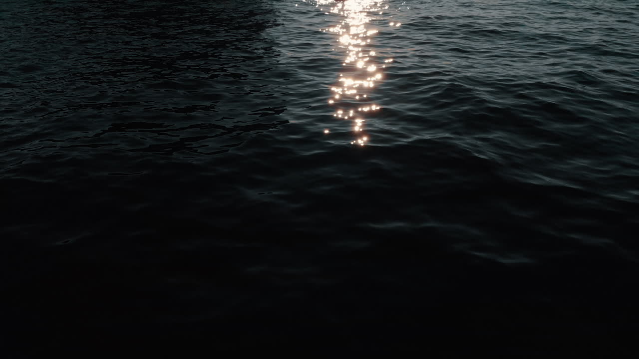 Sunset Reflections on Water with Kayaker