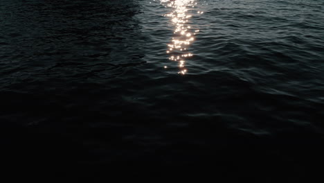 sunset reflections on water with kayaker