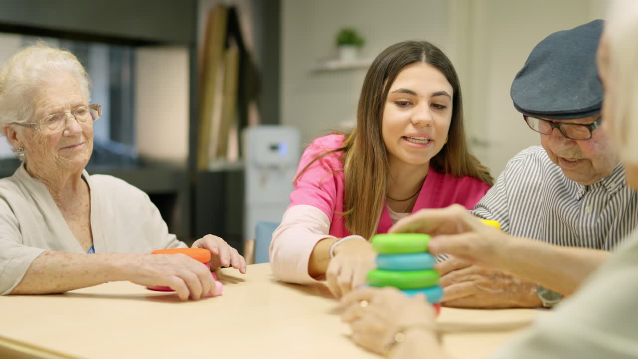 Group of seniors playing a game with a caregiver