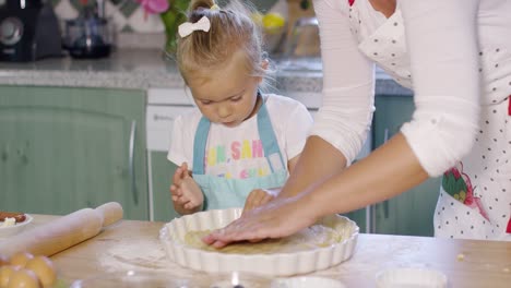 Mother-and-daughter-baking-a-homemade-pie