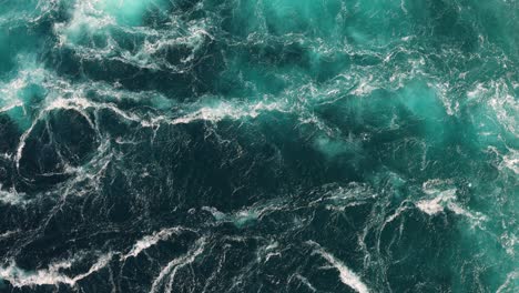 blue waves of water of the river and the sea meet each other during high tide and low tide.