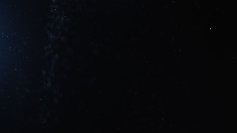 fondo negro de 4k de partículas, polvo y humo en movimiento