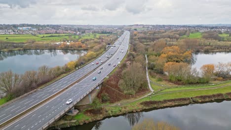 aerial drone cinematic video footage of the m1 motorway near the city of wakefield, west yorkshire, uk