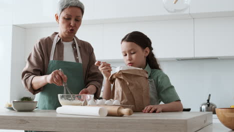 grandma and girl baking