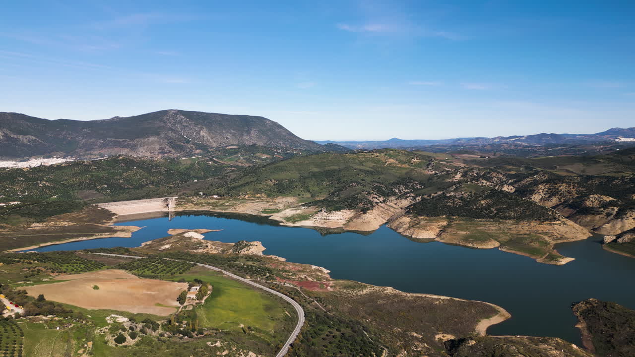 Aerial over the Zahara-el Gastor Reservoir, and olive groves.