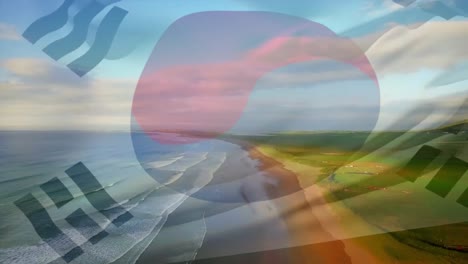 composición digital de ondear la bandera de corea del sur contra la vista aérea de la playa y las olas del mar