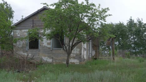 abandoned rural house in a field