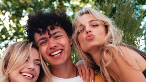 happy friends taking a selfie outdoors