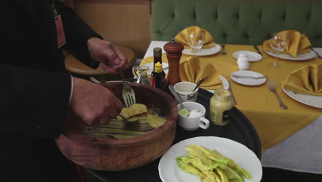 chef preparing a caesar salad in a restaurantc