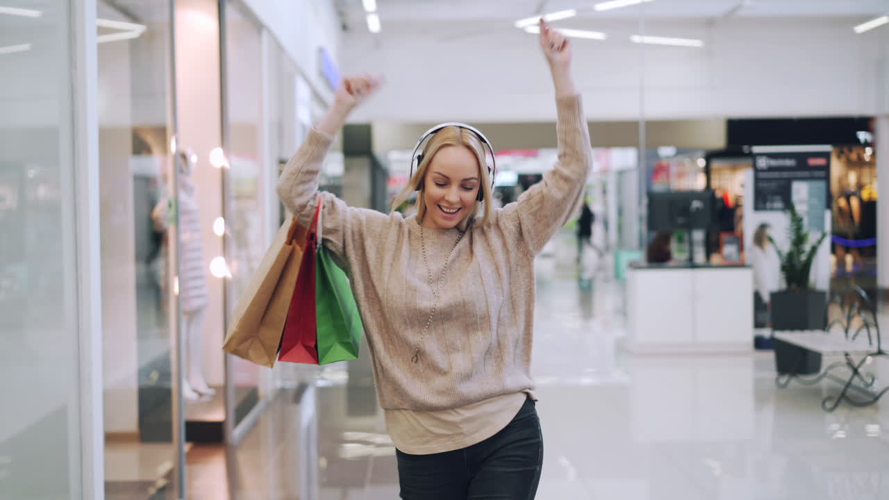 Happy Woman Shopping in a Mall