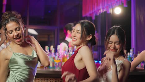 women dancing at a nightclub