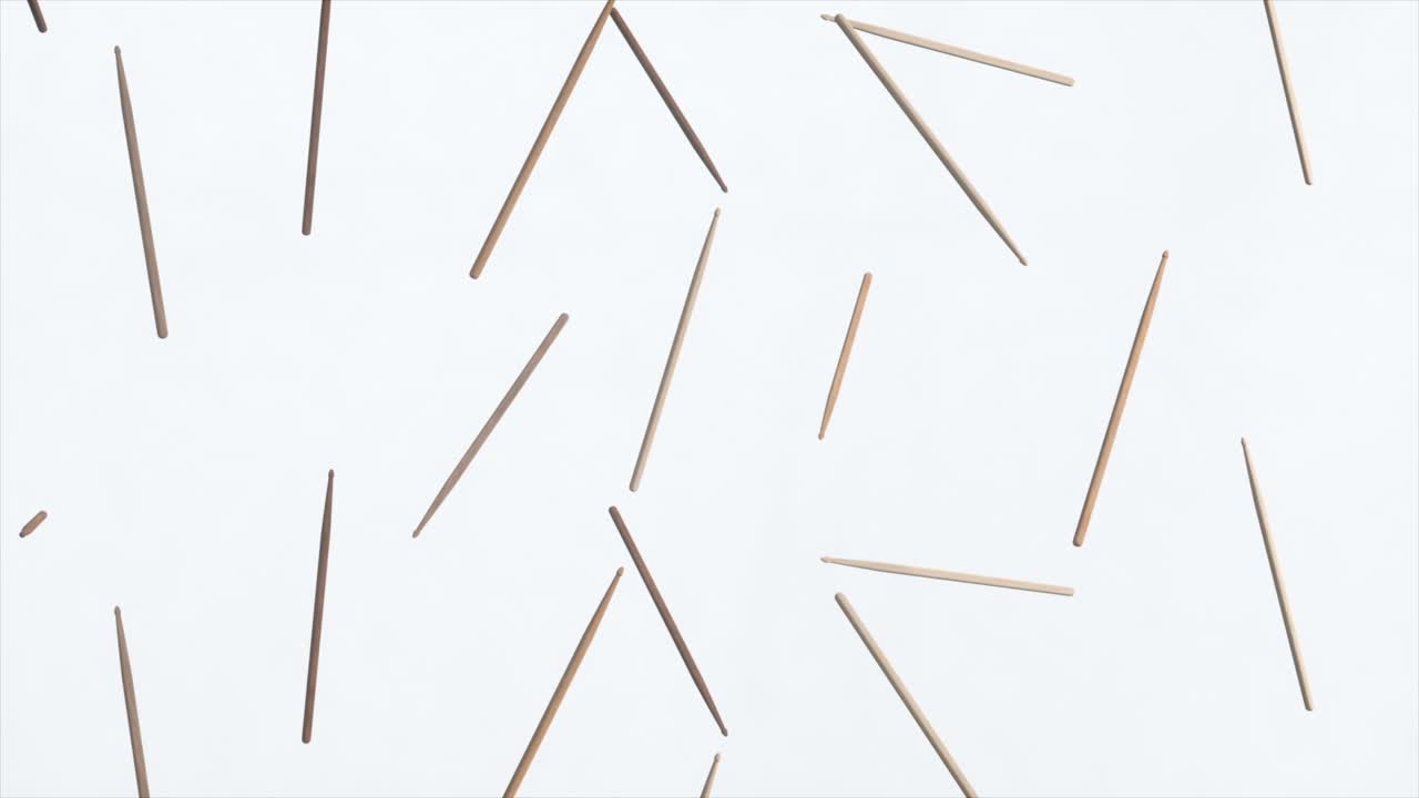 palos de tambor esparcidos sobre un fondo blanco