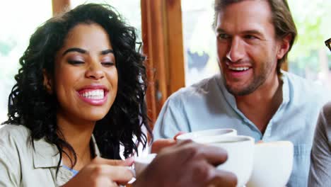 Group-of-friends-toasting-black-coffee