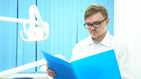 dentist reviewing patient records