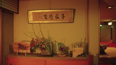 ikebana flower arrangement in traditional ryokan style inn in japan