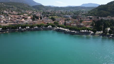 slow approach towards garda harbor at lake garda, italy