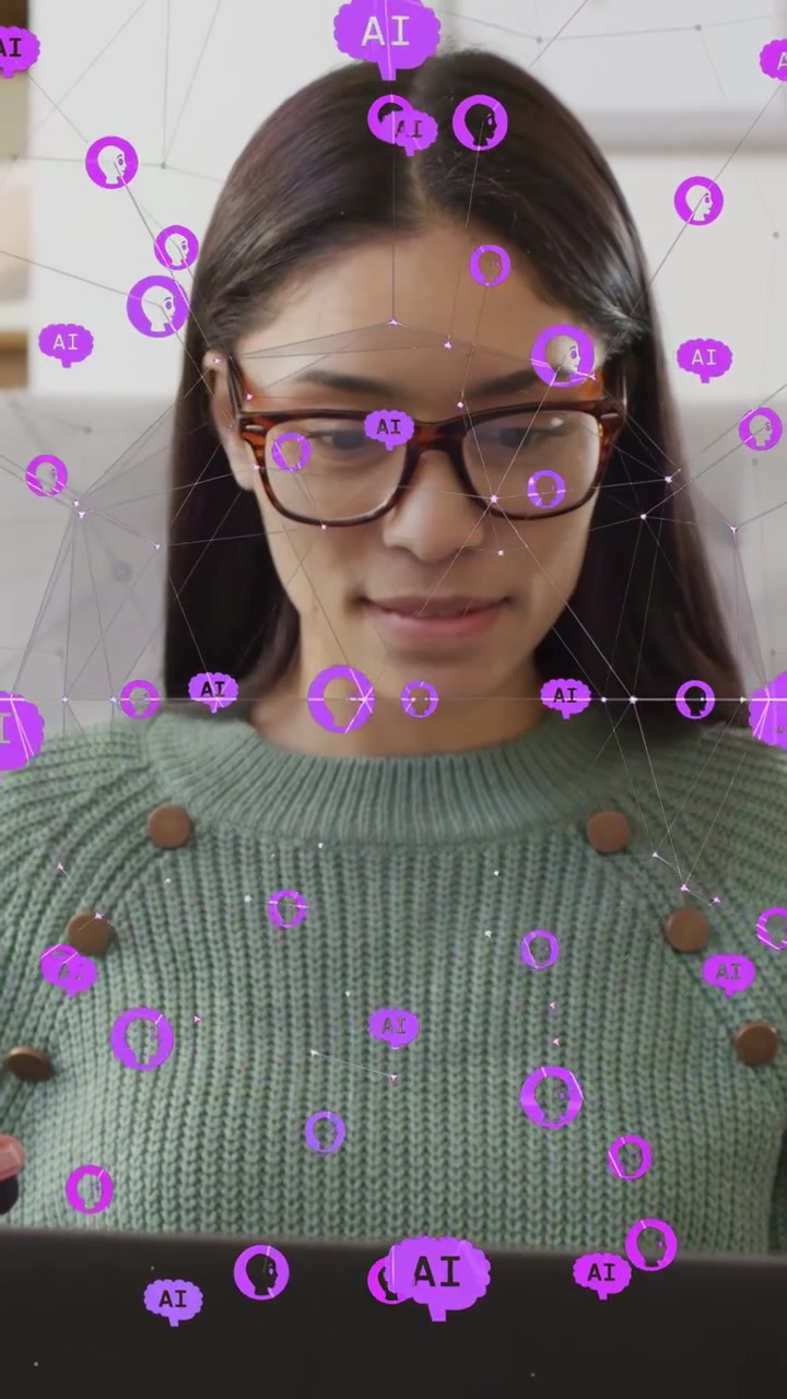 Vertical video: woman typing on laptop, causing purple AI nodes shifting across torso for tech work