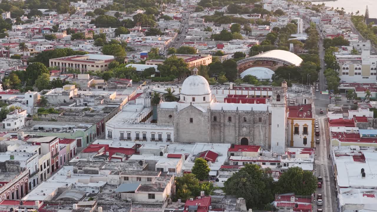 Side-moving aerial view of the historic Ex-Templo de San José and Instituto Campechano in downtown Campeche