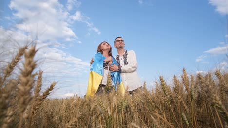 a Couple in Love on a Wheat Field Dressed in National Clothes and with the Flag of Ukraine a Couple in Love on a Wheat Field Dressed in National Clothes and with the Flag of Ukraine a Beautiful Ukrainian Family in the Middle of a Field