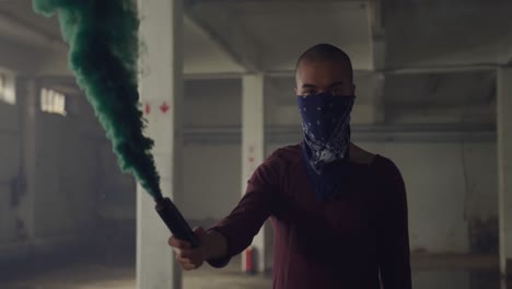 fashionable young man in an abandoned warehouse