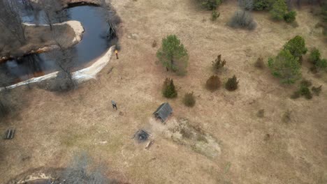 aerial: shed nar the river in dzukija national park in lithuania