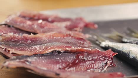 raw sardines on a tray