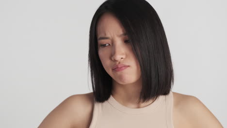 Asian-woman-looking-offended-on-camera.