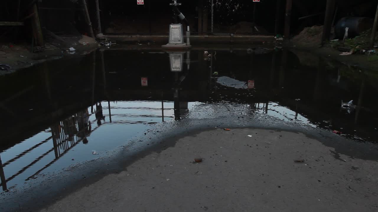 Close up of puddle on boardwalk at Brighton Beach in Brooklyn, New York City