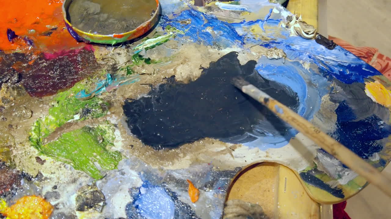 Close up of different colours of paint on a palette