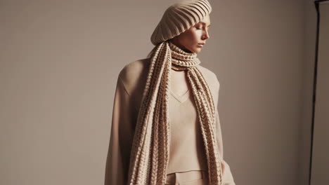 close-up portraits of a woman in cozy beige knitted winter wear