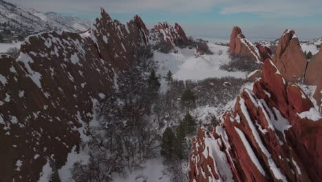 Roxborogh-State-Park-Golf-Course-aerial-drone-Colorado-Front-Range-after-winter-spring-deep-powder-fresh-snow-on-dramatic-sharp-red-rocks-Littleton-Morrison-wildlife-southwest-Denver-afternoon-forward