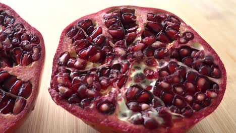 rotating pomegranate fruit and seeds, top view, 4k