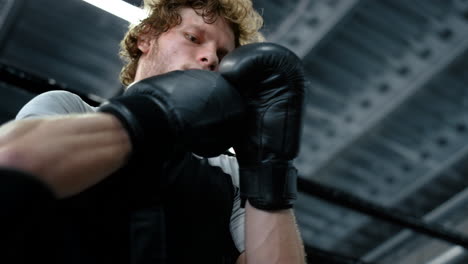 kickboxer putting on boxing gloves