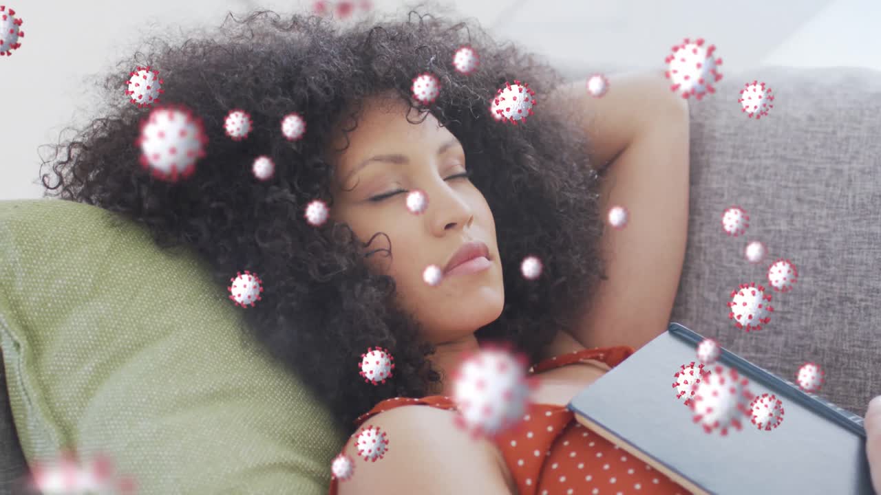 Animation of virus cells over african american woman sleeping