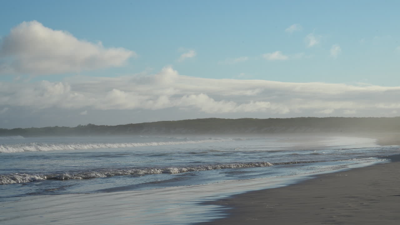 Ocean Spray Off Waves Breaking On Tortuga Bay Beach On Santa Cruz Island In The Galapagos. Slow Motion