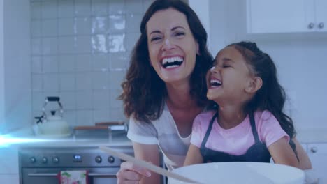 Animation-of-glowing-spots-over-happy-biracial-mother-with-daughter-baking-together