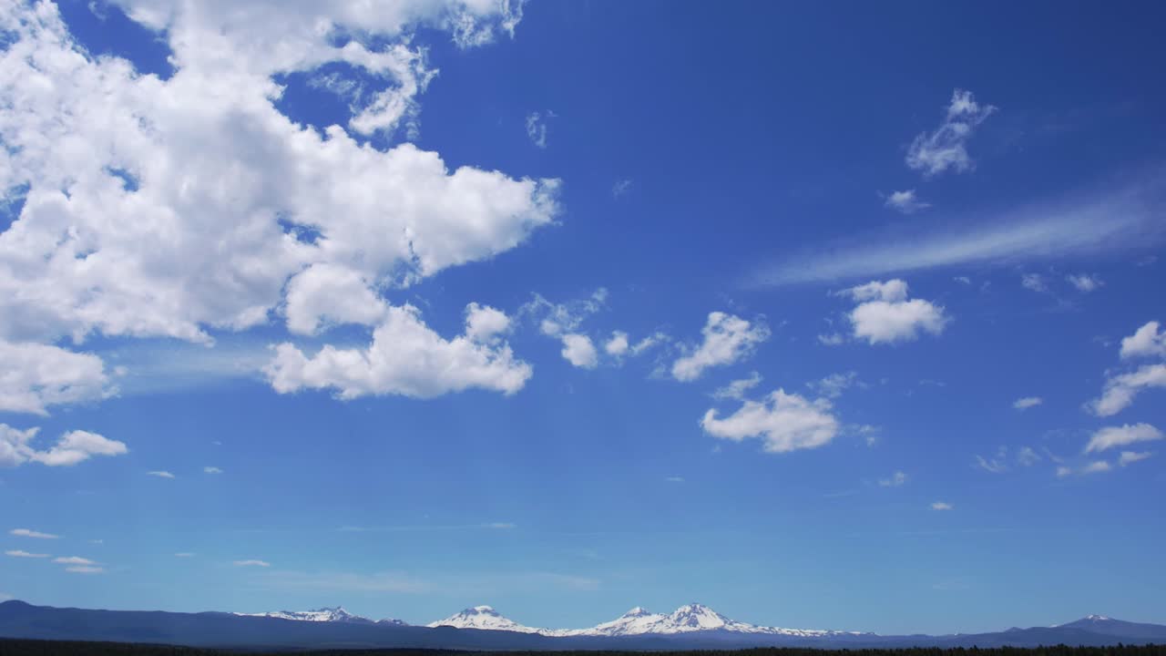 Time-Lapse Shot of Snow-Capped Mountains in Distance