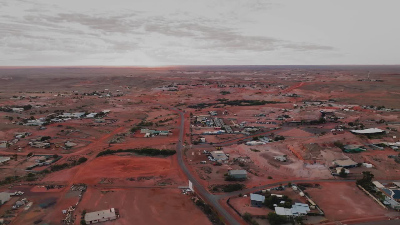First light Aerial tacking shot over Outback town