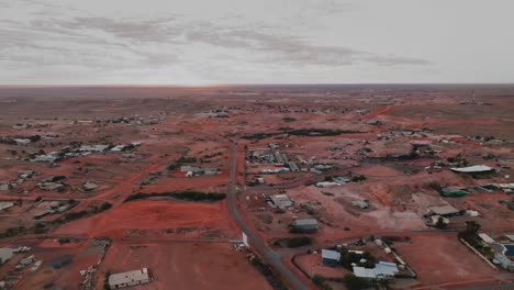 first light aerial tacking shot over outback town