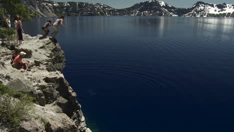 People-jump-into-the-waters-of-Crater-Lake-Oregon