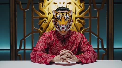 man wearing a tiger mask in traditional chinese attire