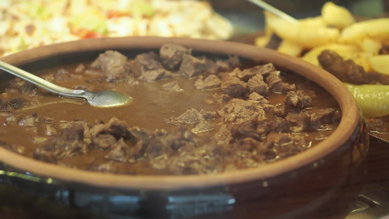 Meat stew in clay pot with Turkish cuisine dishes